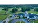 Aerial view of the community clubhouse, golf course and expansive parking area at 3198 Highland Forge Trl, Dacula, GA 30019