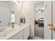 Bathroom with double vanity and a view into the bedroom at 3198 Highland Forge Trl, Dacula, GA 30019