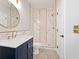 Stylish bathroom featuring gold fixtures, marble-style tiling, and a stand-up shower at 3198 Highland Forge Trl, Dacula, GA 30019