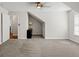 Neutral bedroom featuring gray carpet, ceiling fan, and an adjoining walk-in closet space at 3198 Highland Forge Trl, Dacula, GA 30019