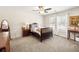 Bedroom with two windows, neutral carpet, and a ceiling fan at 3198 Highland Forge Trl, Dacula, GA 30019