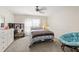 Neutral bedroom features a chair, ceiling fan, and comfortable carpet at 3198 Highland Forge Trl, Dacula, GA 30019