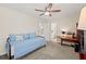 Bedroom with neutral carpet, ceiling fan, and a trundle bed at 3198 Highland Forge Trl, Dacula, GA 30019