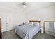 Cozy bedroom featuring a striped bedspread, carpeted floors, and mirrored closet doors at 3198 Highland Forge Trl, Dacula, GA 30019