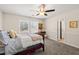 Bedroom with a ceiling fan, two windows, and neutral carpet at 3198 Highland Forge Trl, Dacula, GA 30019