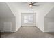 Empty bonus room with neutral carpet, a window, and white walls at 3198 Highland Forge Trl, Dacula, GA 30019