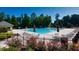 Beautiful community pool area with lounge chairs and shaded gazebo under a sunny sky at 3198 Highland Forge Trl, Dacula, GA 30019