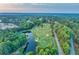 Scenic aerial view of the lush green golf course and surrounding community at 3198 Highland Forge Trl, Dacula, GA 30019