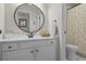 This bathroom includes a single vanity, a toilet, and a shower with a polka dot curtain at 3433 Pinemont Dr, Douglasville, GA 30135