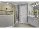 Bathroom includes a large glass shower, tile flooring, and updated fixtures at 3433 Pinemont Dr, Douglasville, GA 30135