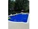 Refreshing pool with lounge area for the perfect summer relaxation at 3433 Pinemont Dr, Douglasville, GA 30135