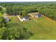 Aerial view of two homes featuring expansive lawns and surrounding greenery at 1300 Snapping Shoals Rd, Mcdonough, GA 30252