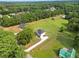 Expansive aerial view of a home nestled on a spacious green lot in a serene, tree-lined neighborhood at 1300 Snapping Shoals Rd, Mcdonough, GA 30252