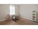 Neutral bedroom with carpet, desk, and a comfortable chair near a window at 1300 Snapping Shoals Rd, Mcdonough, GA 30252