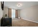 Bright bedroom with carpeted floors, natural light, and neutral color palette at 1300 Snapping Shoals Rd, Mcdonough, GA 30252