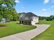 Spacious two-story home with a long driveway and a well-manicured lawn at 1300 Snapping Shoals Rd, Mcdonough, GA 30252