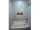 Newly remodeled shower with marble tile surround and convenient built-in niche at 1766 Venetian Sw Dr, Atlanta, GA 30311