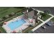 Overhead view of a community clubhouse with pool, outdoor seating, and parking at 3336 Cranston Ln, Kennesaw, GA 30144