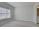 Bedroom with neutral carpet, window with blinds, and access to ensuite bathroom at 3336 Cranston Ln, Kennesaw, GA 30144