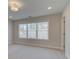 Bright bedroom with large window, plush carpeting, and neutral walls at 3336 Cranston Ln, Kennesaw, GA 30144