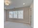 Cozy bedroom with a large window, neutral carpeting, and freshly painted walls, offering a tranquil space at 3336 Cranston Ln, Kennesaw, GA 30144