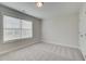 Bright bedroom with plush carpet, large window, and neutral walls, creating a serene retreat at 3336 Cranston Ln, Kennesaw, GA 30144