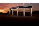 Kennesaw State University entrance sign, back-lit against the sunset at 3336 Cranston Ln, Kennesaw, GA 30144