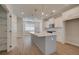 Bright kitchen featuring white cabinets, stainless steel appliances, and a central island with pendant lighting at 3336 Cranston Ln, Kennesaw, GA 30144