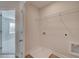 Laundry room with washer and dryer hookups, shelving, and door that leads to another room at 3336 Cranston Ln, Kennesaw, GA 30144