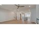 Open-concept living room with hardwood floors, modern fireplace, and view into the kitchen at 3336 Cranston Ln, Kennesaw, GA 30144