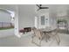 Covered poolside seating area includes a brick fireplace, lounge furniture and beautiful flower accents at 3336 Cranston Ln, Kennesaw, GA 30144