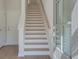 Bright foyer showcases the staircase with light wood treads and white risers at 3336 Cranston Ln, Kennesaw, GA 30144