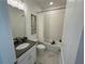 Bathroom with gray countertops, subway tile, framed art, and a shower-tub combo at 3987 Allegretto Cir # 250, Atlanta, GA 30339