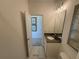 Bathroom with marble floors, neutral walls, and a door leading to another room at 3987 Allegretto Cir # 250, Atlanta, GA 30339