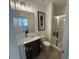 Bathroom with modern vanity, fixtures, framed mirror, and glass-enclosed shower at 3987 Allegretto Cir # 250, Atlanta, GA 30339