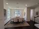 Bright dining room featuring a modern chandelier, dining table, and large windows at 3987 Allegretto Cir # 250, Atlanta, GA 30339