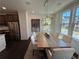 Bright dining room featuring a modern chandelier and large windows for natural lighting at 3987 Allegretto Cir # 250, Atlanta, GA 30339