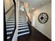 Inviting foyer with staircase, dark hardwood floors, and elegant decor at 3987 Allegretto Cir # 250, Atlanta, GA 30339