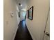 Hallway featuring hardwood floors, neutral walls, and modern decor at 3987 Allegretto Cir # 250, Atlanta, GA 30339