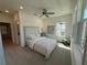 Bright main bedroom featuring a ceiling fan, bedside table, and multiple windows for natural light at 3987 Allegretto Cir # 250, Atlanta, GA 30339