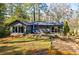 Charming backyard with a deck, seating, and lush greenery, ideal for entertaining at 727 Cool Hollow Dr, Decatur, GA 30033