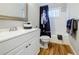 Bright bathroom with white vanity, tub/shower combo, and modern fixtures at 727 Cool Hollow Dr, Decatur, GA 30033