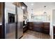 A stainless steel refrigerator complements the dark wood cabinetry in this well-appointed kitchen at 727 Cool Hollow Dr, Decatur, GA 30033