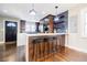 A full view of kitchen with an island with bar stool seating, a doorway, and a window at 727 Cool Hollow Dr, Decatur, GA 30033