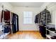 This walk-in closet features custom shelving and rods for maximum storage with a window for natural light at 727 Cool Hollow Dr, Decatur, GA 30033