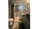 Bathroom featuring granite countertops, modern fixtures, and a convenient tub-shower combination at 123 Spring St, Stockbridge, GA 30281