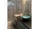 Well-lit bathroom featuring modern vanity, granite countertops, and tub-shower combo at 123 Spring St, Stockbridge, GA 30281