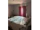 Bright bedroom with natural light and a comfy bed at 123 Spring St, Stockbridge, GA 30281