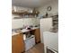 Cozy kitchen space features ample counter space and wooden cabinets, ready for upgrades at 123 Spring St, Stockbridge, GA 30281