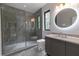 Bathroom featuring a modern glass shower and a lighted vanity mirror at 1653 Wayland Ne Cir, Brookhaven, GA 30319
